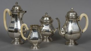 A French four piece silver tea set Of bulbous octagonal form, with ivory loop handles.