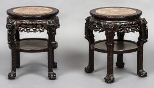 A pair of late 19th century Chinese carved hardwood marble topped side tables Each of typical