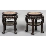 A pair of late 19th century Chinese carved hardwood marble topped side tables Each of typical