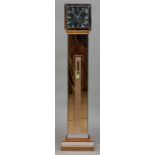 A mid 20th century Art Deco style electrical clock The mirrored dial with batons above the rose