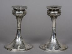 A pair of George V silver candlesticks, hallmarked Birmingham 1933,