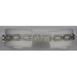 An Art Deco style 18 ct white gold diamond set bracelet Set with approximately 2.