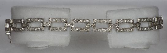 An Art Deco style 18 ct white gold diamond set bracelet Set with approximately 2.