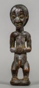 An African carved tribal figure Formed as a male figure. 24.5 cm high.