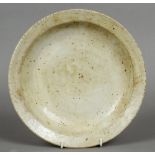 A Chinese porcelain shallow dish With all over white crackle glaze, blue painted mark to base.