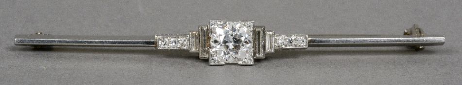 An Art Deco 18 ct white gold and platinum diamond set bar brooch The central stone approximately 0.