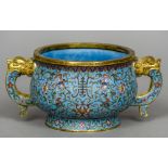 A Chinese cloisonne twin handled Ding censor Allover worked with lotus strapwork,