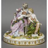A late 19th century Continental porcelain figural group Formed as two young women clipping a