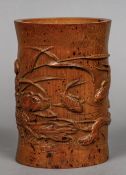 A late 19th/early 20th century Chinese carved bamboo brush pot Of flared cylindrical form,