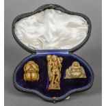 A 19th century Japanese ivory okimono Formed as three entwined fishermen,