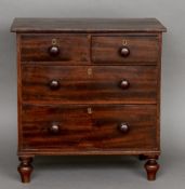 A 19th century mahogany miniature chest of drawers The rectangular top above an arrangement of two