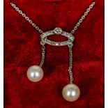 An Edwardian white gold or platinum diamond and pearl set necklace 44 cm long.