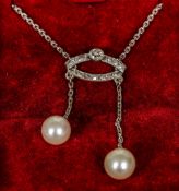 An Edwardian white gold or platinum diamond and pearl set necklace 44 cm long.