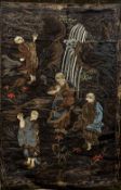 A 19th century Japanese silk work wall hanging Decorated with various figures in a landscape.