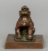 A large Chinese patinated bronze seal Mounted with a dog-of-fo. 10 cm high.