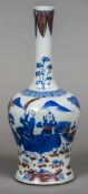 A Chinese blue and white porcelain vase Decorated with figures in a continuous garden with iron red