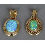 Two 14 ct gold opal set pendants Each of cabochon form, one with pierced border.