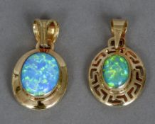 Two 14 ct gold opal set pendants Each of cabochon form, one with pierced border.