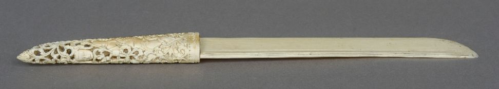 A 19th/20th century Chinese carved Canton ivory page turner The handle profusely carved and pierced