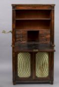 A 19th century rosewood secretaire The line inlaid fall enclosing a leather writing surface,