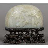 A 19th century Chinese carved mutton fat jade plaque Of domed bowed form,