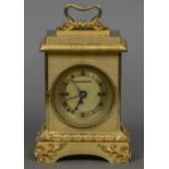 A fine quality gilt bronze repeating carriage clock The scrolling handle above the stepped top with