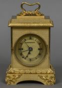 A fine quality gilt bronze repeating carriage clock The scrolling handle above the stepped top with