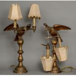 A pair of 19th century carved giltwood table lamps Each formed as an eagle holding twin branches,