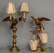 A pair of 19th century carved giltwood table lamps Each formed as an eagle holding twin branches,