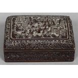 A 19th century Chinese cinnabar lacquered box The domed removable lid decorated with figures and