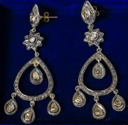 A pair of rough cut diamond drop earrings Set in silver. Each 7.5 cm long.