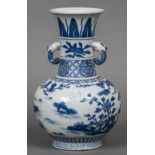 A Chinese blue and white porcelain twin handled vase Decorated with deer in a continuous landscape.