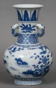 A Chinese blue and white porcelain twin handled vase Decorated with deer in a continuous landscape.