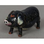 A Chinese cloisonne pig Naturalistically modelled. 10.5 cm long.