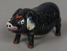 A Chinese cloisonne pig Naturalistically modelled. 10.5 cm long.