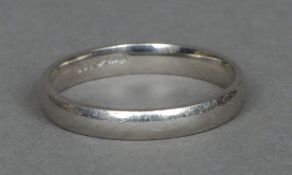 A platinum wedding band Sold with copy of original receipt.