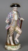 A Continental porcelain figure of a young gardener Blue painted crossed tridents mark to base.