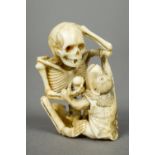 A late 19th century Japanese ivory okimono Intricately carved as a skeleton and a monkey,