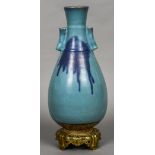 A 19th century Oriental turquoise ground vase Of spreading ovoid form,