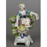 A Dresden porcelain figure Modelled as a woman selling sheet music and other works on paper,