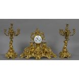 A large 19th century French ormolu clock garniture Of pierced scrolling floral form,