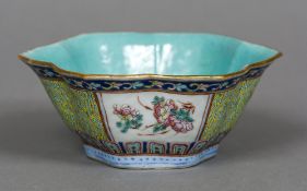 A Chinese porcelain bowl Of lobed form, decorated with floral vignettes,