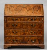 An 18th century burr walnut bureau The feather banded fall enclosing a fitted interior above four