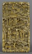 A small 19th century Cantonese carved ivory card case Typically decorated with figures amongst