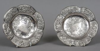 A pair of Victorian Scottish silver coasters, hallmarked Edinburgh 1886,