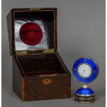 A rose diamond set silver mounted enamel desk clock The white enamelled dial bordered by a row of