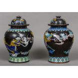 A large pair of late 19th century cloisonne vases Each decorated with bats and mythical beasts,