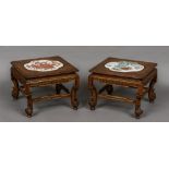 A pair of 19th century Chinese carved wood low tables Each with porcelain panel inset top,