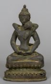 An antique patinated bronze erotic figure of Buddha Modelled seated in the lotus position,