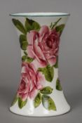 An early 20th century Wemyss ware pottery vase Of circular section with flared rim and typically